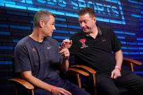 Virginia head coach Tony Bennett, left, and Texas Tech head coach Chris Beard talk after an int ...
