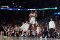 Virginia players celebrate after defeating Auburn 63-62 in the semifinals of the Final Four NCA ...