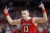 Texas Tech guard Matt Mooney celebrates after making a three-point basket during the second hal ...
