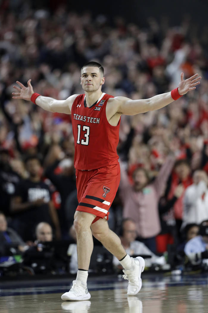 Texas Tech guard Matt Mooney celebrates after making a three-point basket during the second hal ...