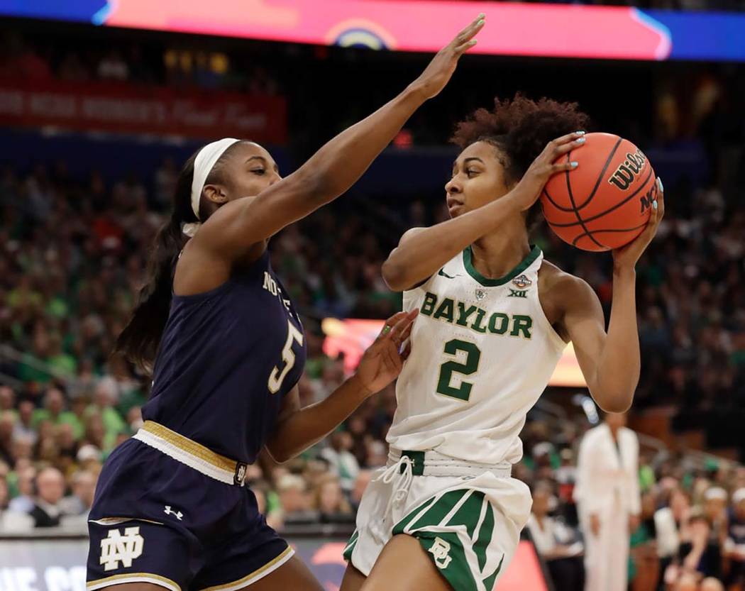 Baylor guard DiDi Richards (2) looks to pass the ball as Notre Dame guard Jackie Young (5) defe ...