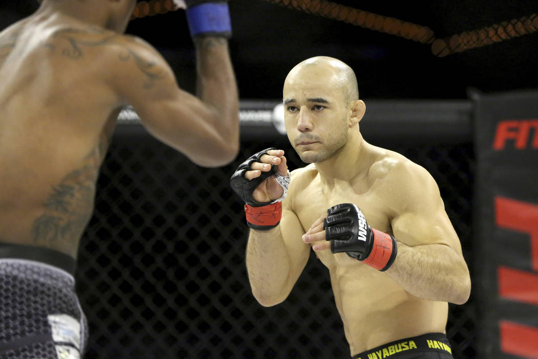 Marlon Moraes in action against Josinaldo Silva during their WSOF bantamweight title fight at t ...