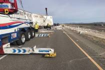 A tractor-trailer, which was hauling 1-gallon and 5-gallon buckets of paint, rolled over on U.S ...