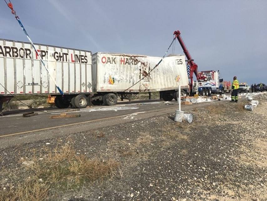 A tractor-trailer, which was hauling 1-gallon and 5-gallon buckets of paint, rolled over on U.S ...