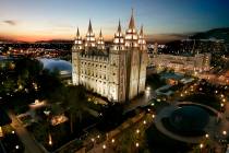The sun sets behind the Mormon Temple, the centerpiece of Temple Square, in Salt Lake City in 2 ...