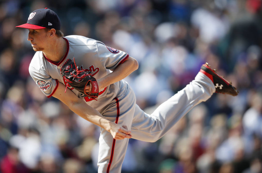 Washington Nationals relief pitcher Erick Fedde works against the Colorado Rockies in the first ...