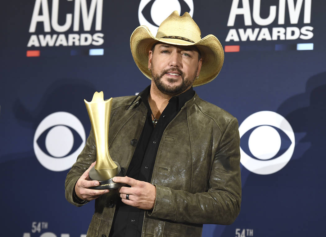 Jason Aldean poses in the press room with the Dick Clark artist of the decade award at the 54th ...