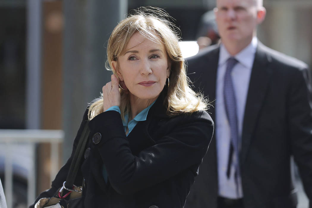 Actress Felicity Huffman arrives at federal court in Boston on Wednesday, April 3, 2019, to fac ...