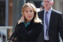 Actress Felicity Huffman arrives at federal court in Boston on Wednesday, April 3, 2019, to fac ...