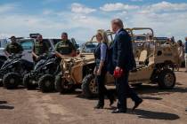 President Donald Trump walks with Homeland Security Secretary Kirstjen Nielsen as they visit a ...