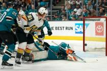 Vegas Golden Knights center Cody Eakin (21) scores a goal over San Jose Sharks goaltender Marti ...