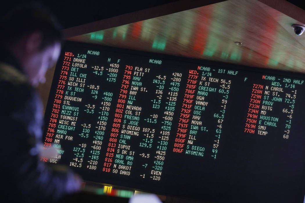 Odds are displayed on a screen at a sports book owned and operated by CG Technology in Las Vega ...