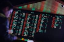 Odds are displayed on a screen at a sports book owned and operated by CG Technology in Las Vega ...