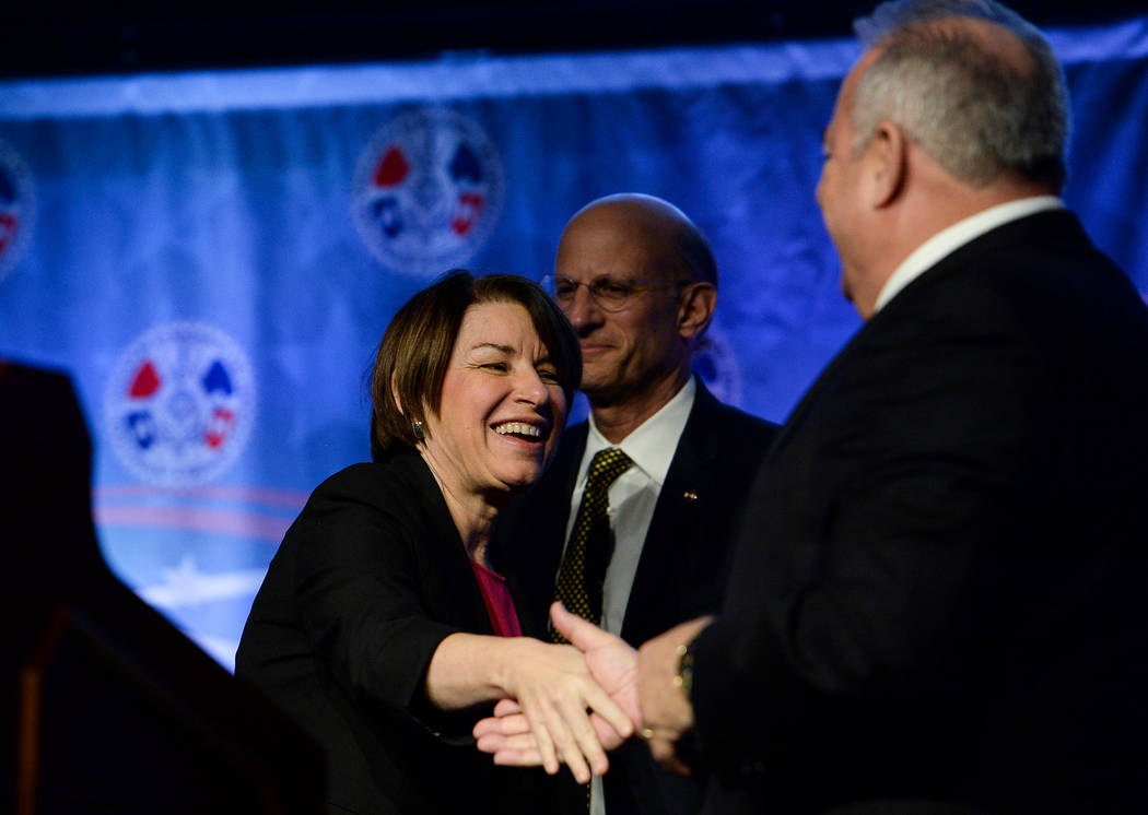 Democratic presidential candidate Sen. Amy Klobuchar, D-Minn., greets people on stage before sp ...