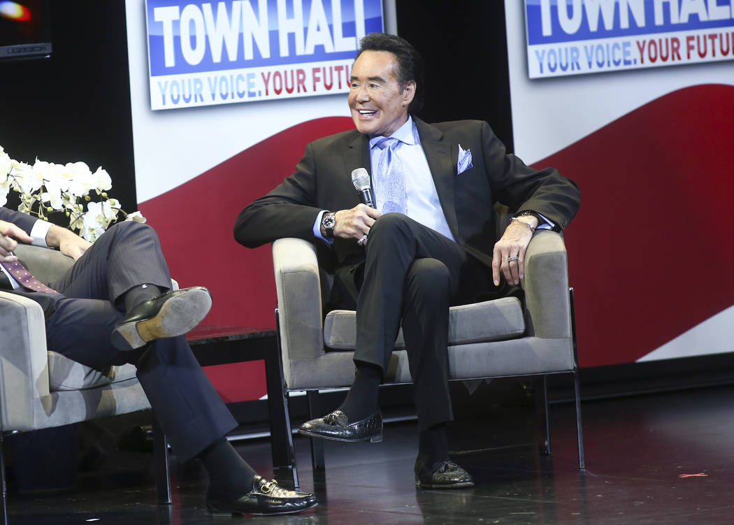 Entertainer Wayne Newton speaks with television personality Eric Bolling during a town hall abo ...