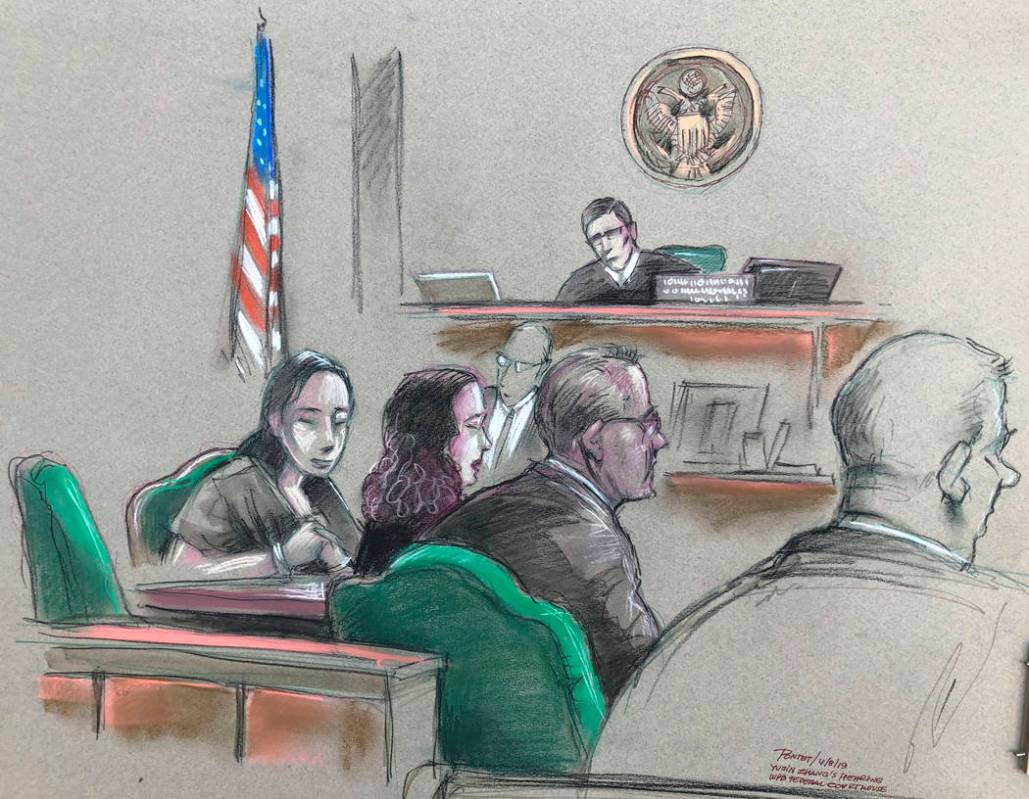In this artist sketch, a Chinese woman, Yujing Zhang, left, listens to a hearing Monday, April ...