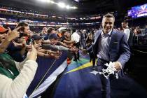 Virginia head coach Tony Bennett celebrates with fans after the championship game against Texas ...