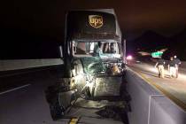 A UPS tractor-trailer sustained severe damage in a head-on crash with another vehicle on the H ...