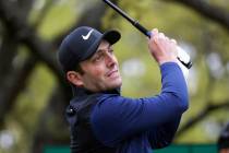 Francesco Molinari watches his drive on the first hole during semifinal play against Kevin Kisn ...