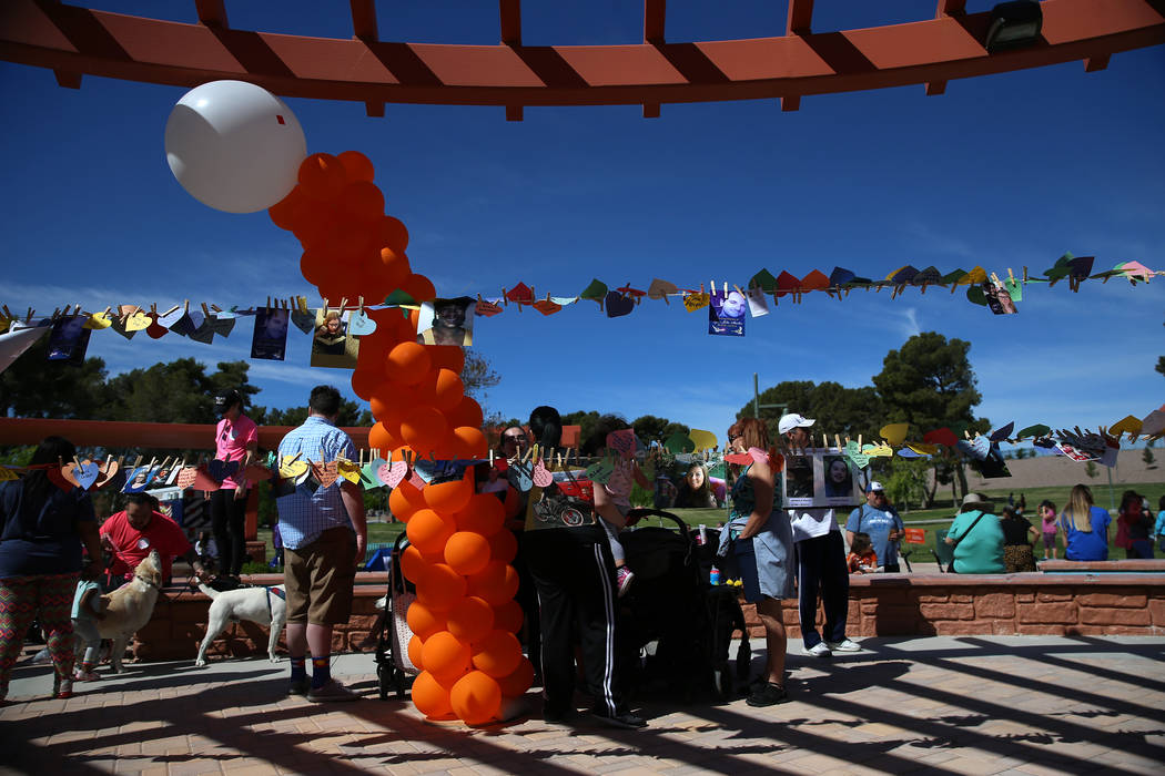 People participate during the Out of the Darkness Community Walk at Craig Ranch Regional Park i ...