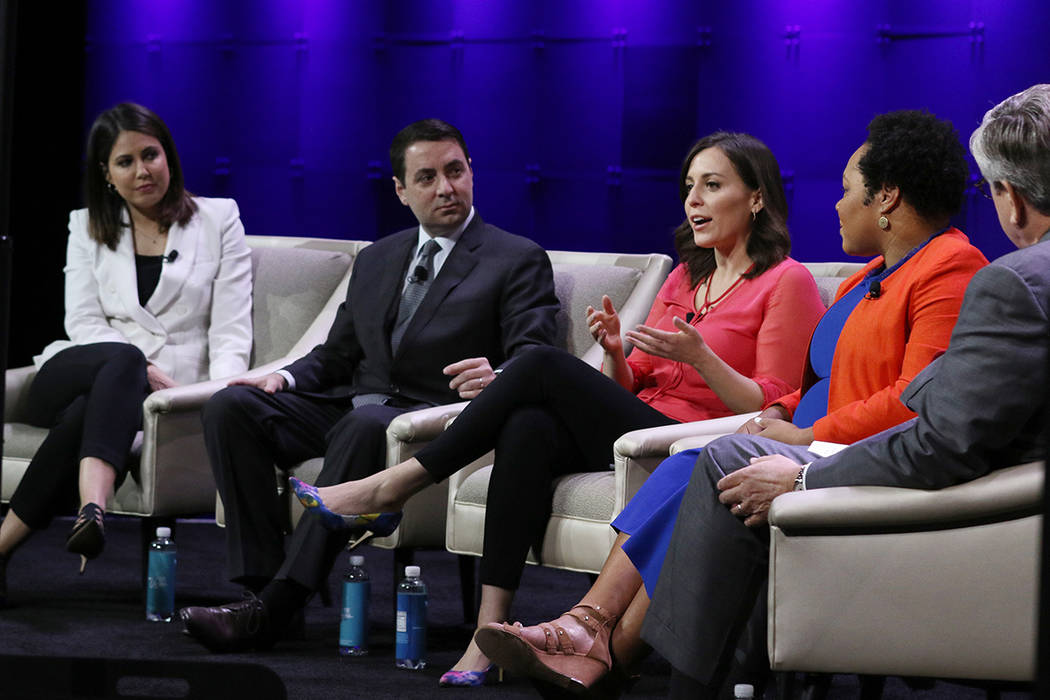 Hallie Jackson, center, chief White House Correspondent at NBC, speaks during a panel discussio ...