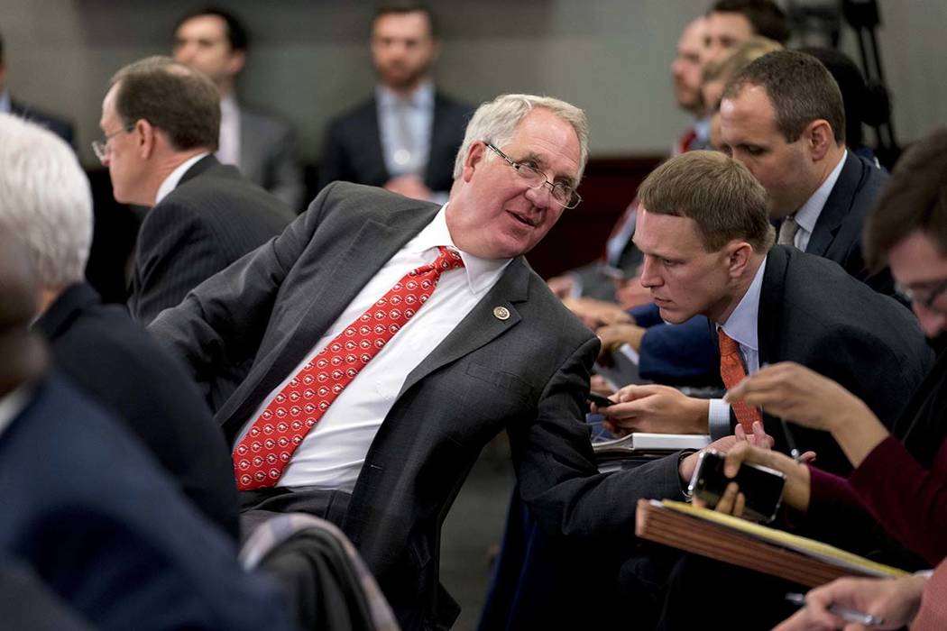 Rep. John Shimkus, R-Ill., speaks with an aide during a House and Senate conference on Capitol ...
