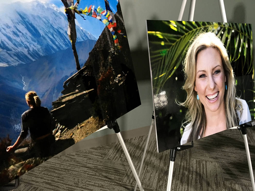 Posters of Justine Ruszczyk Damond are displayed at a news conference by attorneys for her fami ...