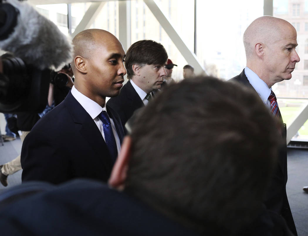 Former Minneapolis police officer Mohamed Noor, center, is accompanied by his attorneys Peter W ...
