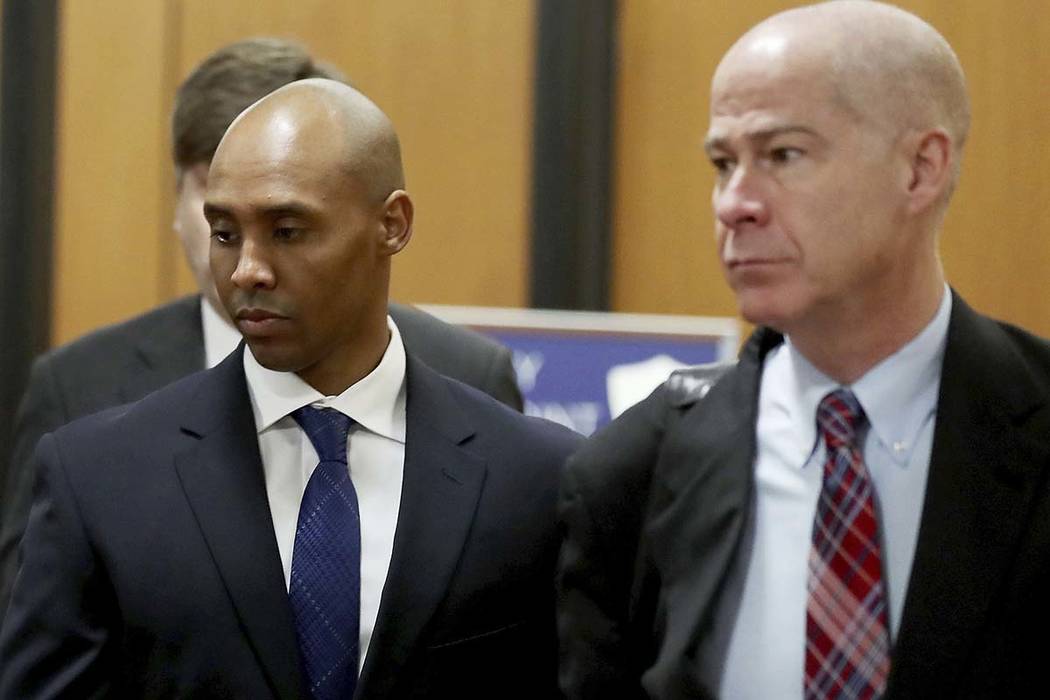Former Minneapolis police officer Mohamed Noor, center, is accompanied by his attorneys Peter W ...