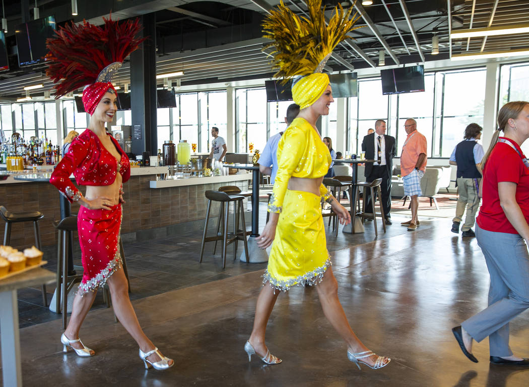 Showgirls move into place on the club level before the Las Vegas Aviators home opener on Tuesda ...