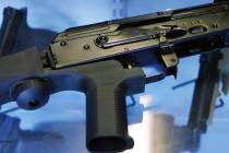 A "bump stock" is attached to a semi-automatic rifle at the Gun Vault store and shooting range ...