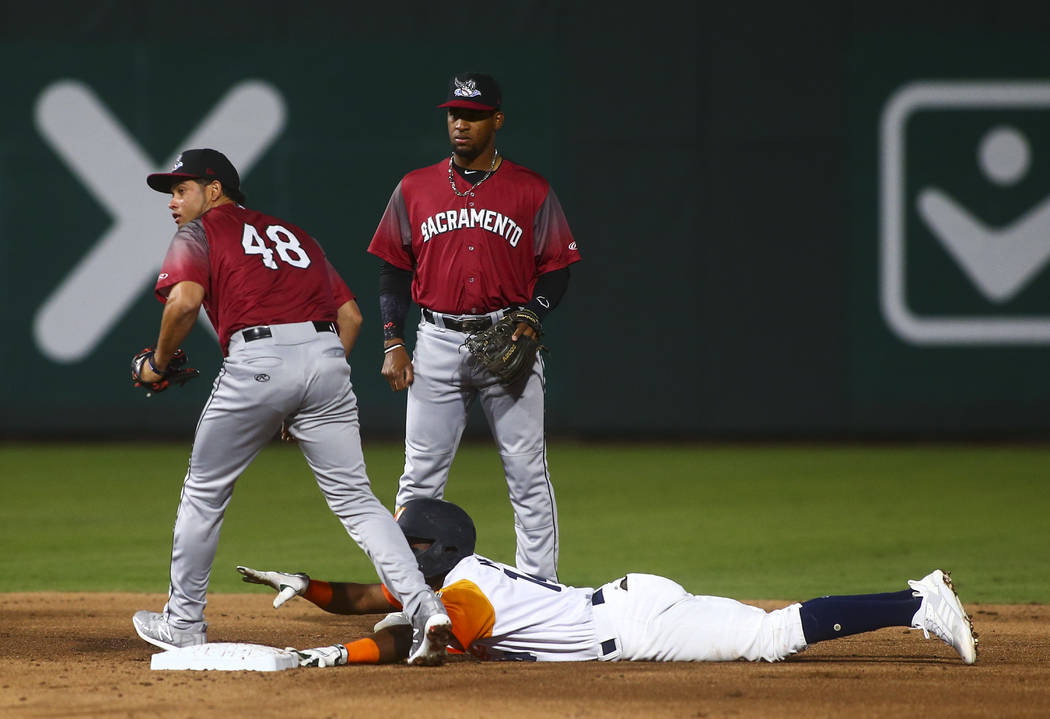 Las Vegas Aviators shortstop Jorge Mateo (14) gets tagged out by Sacramento River Cats second b ...