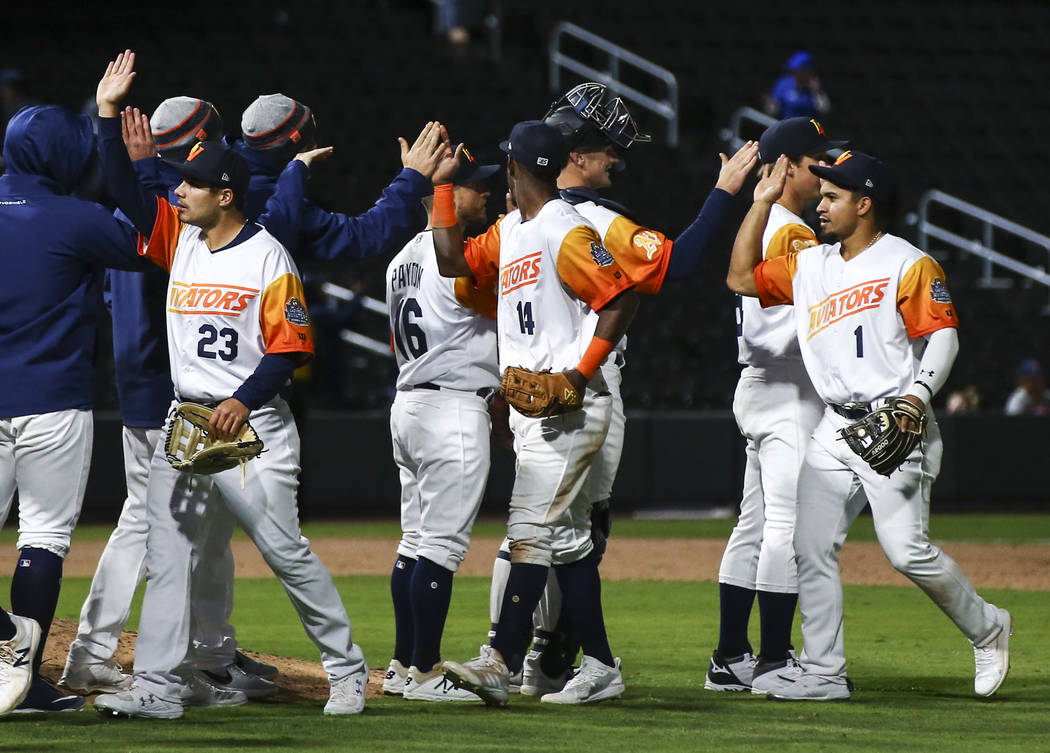 Las Vegas Aviators players celebrate a 10-2 win over the Sacramento River Cats in their home op ...