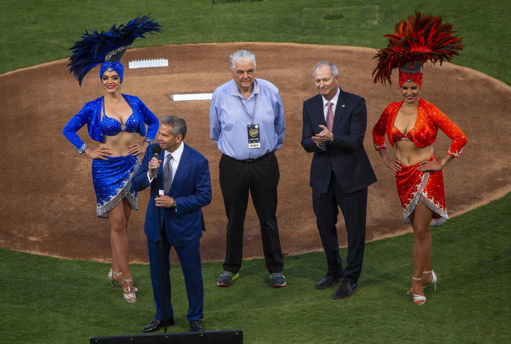 Dignitaries welcome the fans on the mound before the Las Vegas Aviators home opener on Tuesday, ...