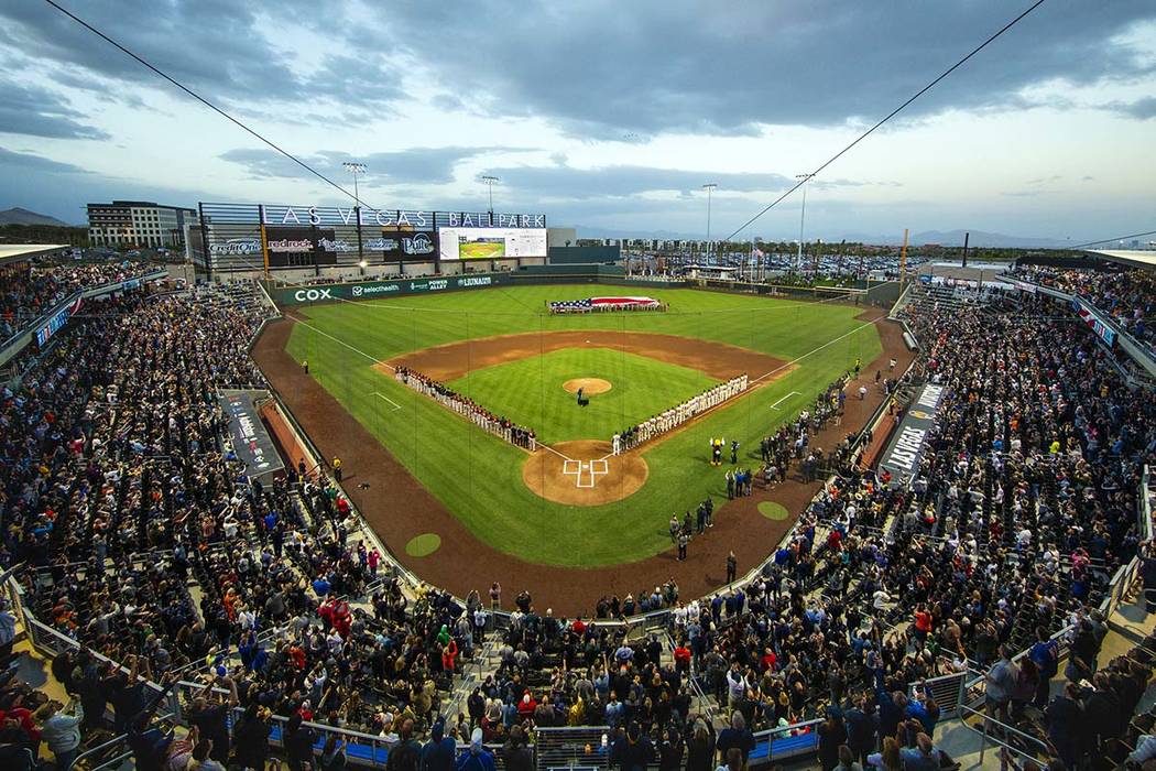 The American flag is unfurled for the national anthem at the Las Vegas Aviators home opener at ...