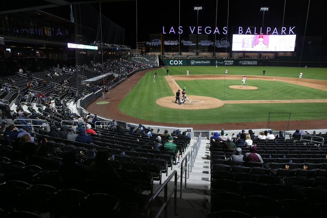 Fans take in the action during the fourth inning on opening night for the Las Vegas Aviators at ...