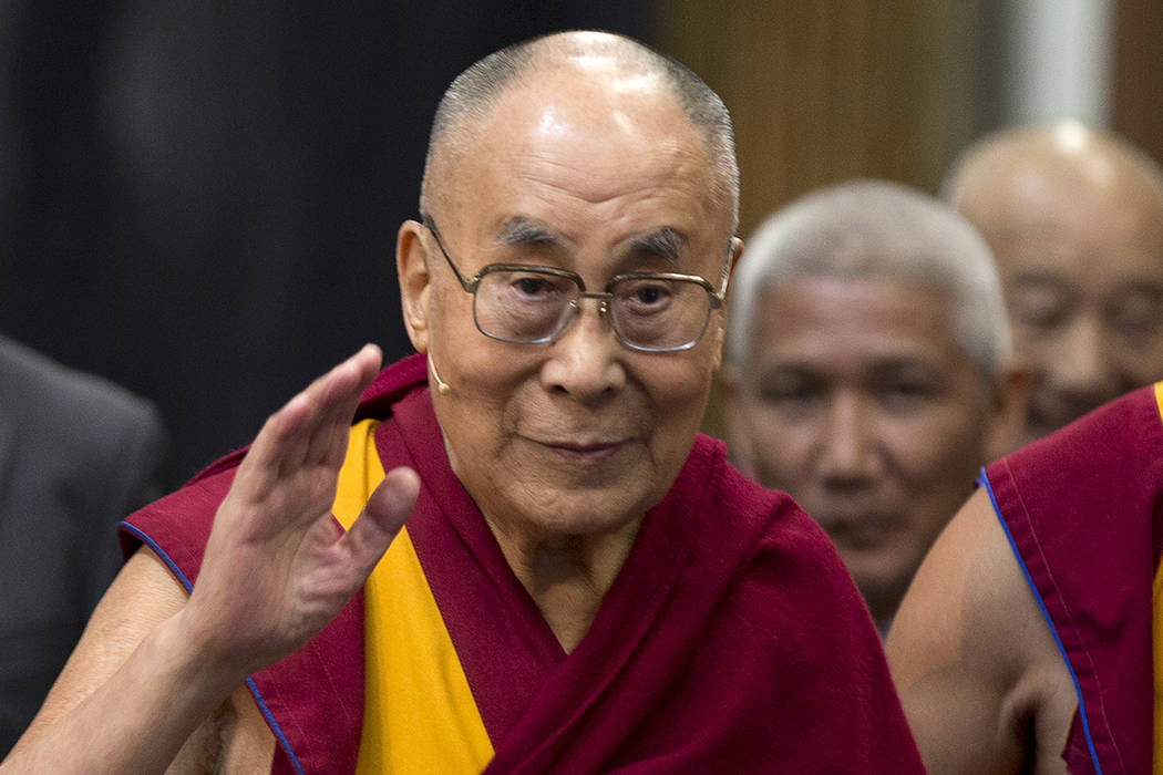 In this Sept. 15, 2018, file photo, Tibetan spiritual leader the Dalai Lama greets journalists ...