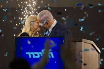 Israel's Prime Minister Benjamin Netanyahu and Likud party leader kisses his wife Sara in from ...