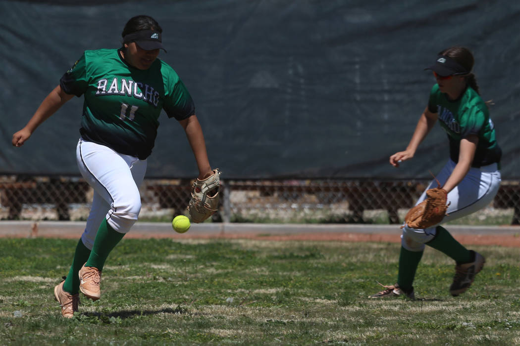 Ranchos' Mia Elicerio (11) watches as the ball falls in the outfield for a Desert Oasis single ...