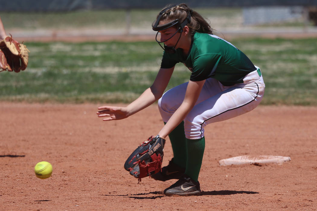 Rancho's Samantha Whalen (10) picks up a ground ball against Desert Oasis in the softball game ...
