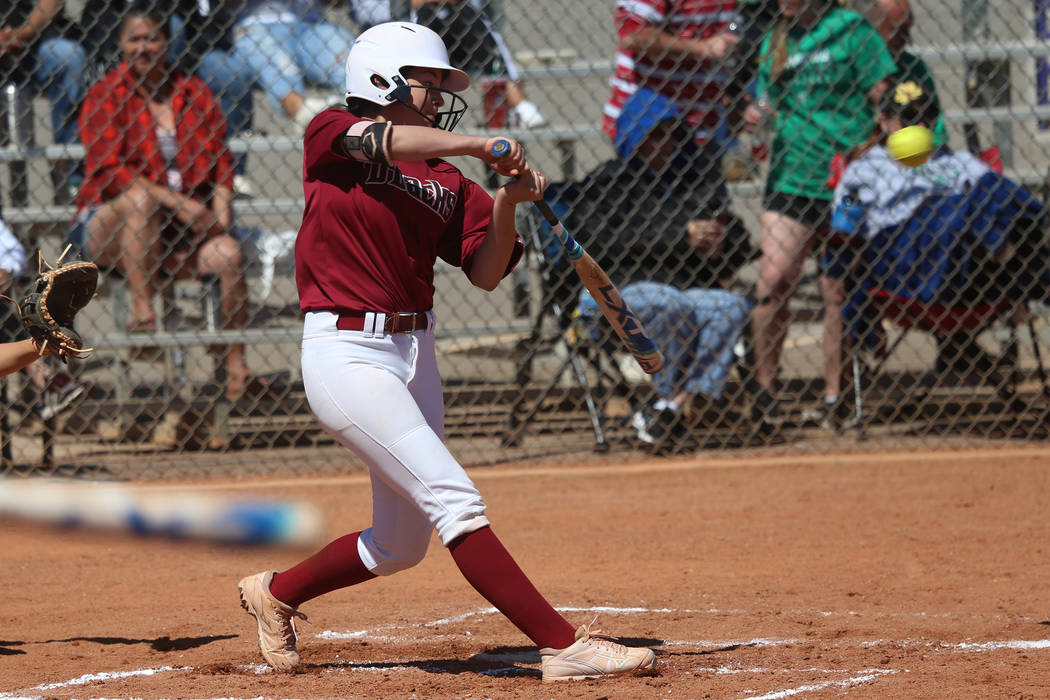 Desert Oasis Ruby Martinez (10) hits the ball for a single against Rancho in the softball game ...