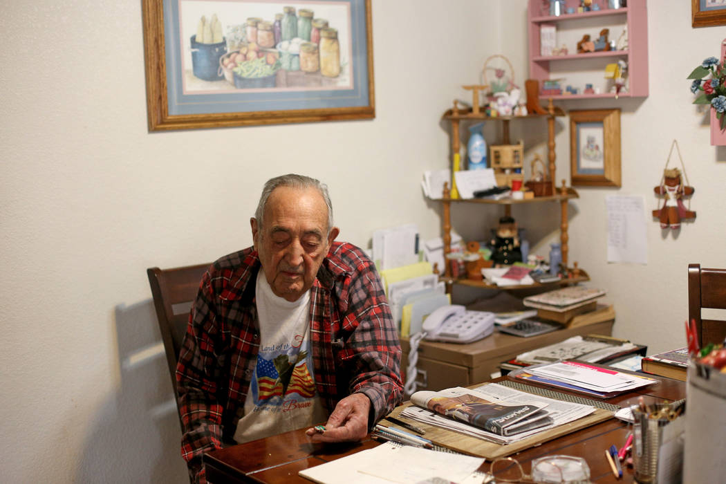Onofrio "No-No" Zicari, 96, shows the the Review-Journal a medal he earned for his th ...