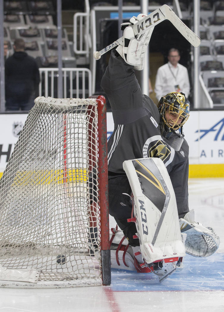 Golden Knights goaltender Marc-Andre Fleury (29) attempts to make a save during morning skate a ...