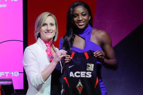 Notre Dame's Jackie Young, right, poses for a photo with WNBA COO Christy Hedgpeth after being ...