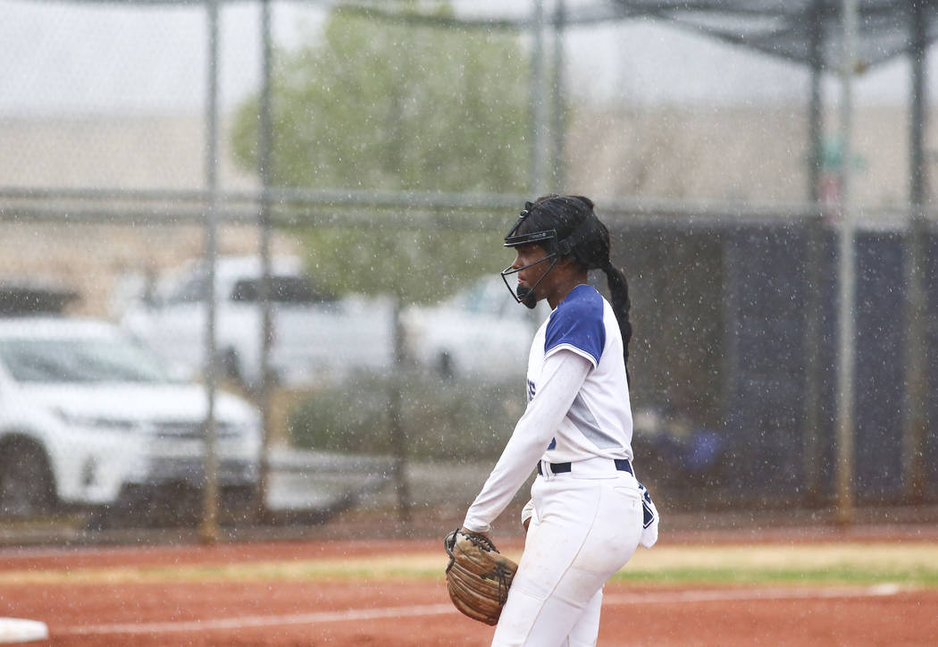 Shadow Ridge's Jasmine Martin (8) gets ready to pitch in the first inning of a softball game as ...