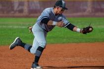 Palo Verde's Paul Myro IV (23) scoops up a grounder from a Faith lutheran batter during their h ...