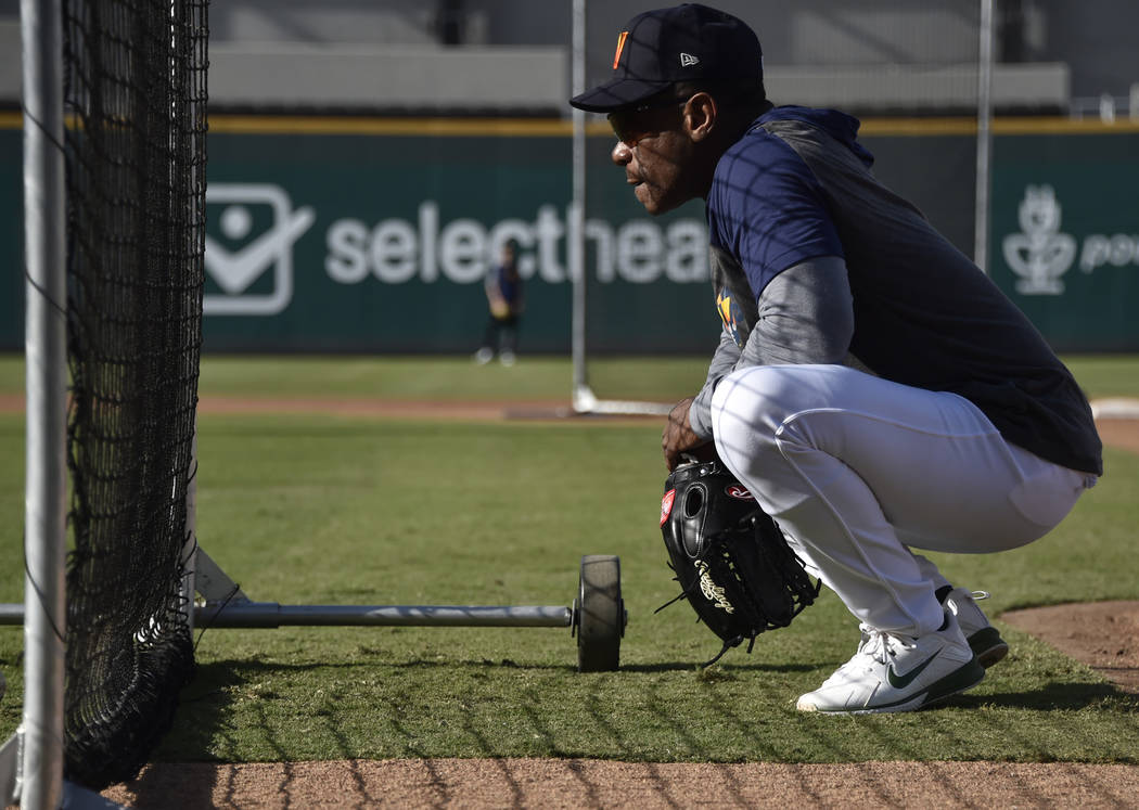 Retired Major League baseball player and now special coach Rickey Henderson works with the Las ...