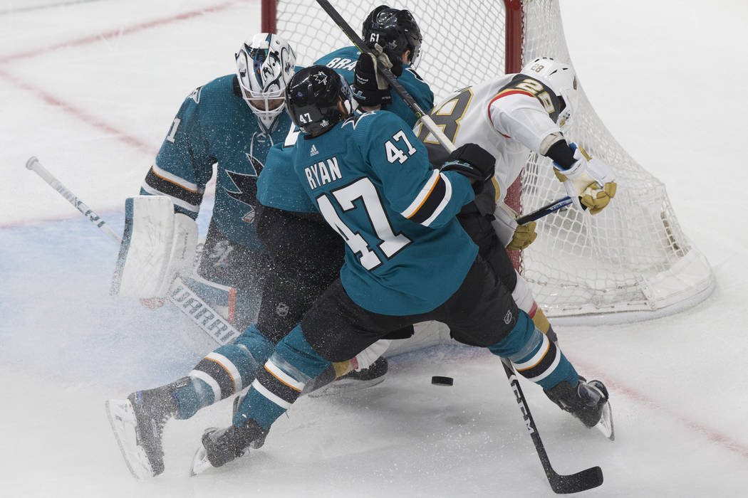 San Jose Sharks goaltender Martin Jones (31) makes a save against Golden Knights left wing Will ...