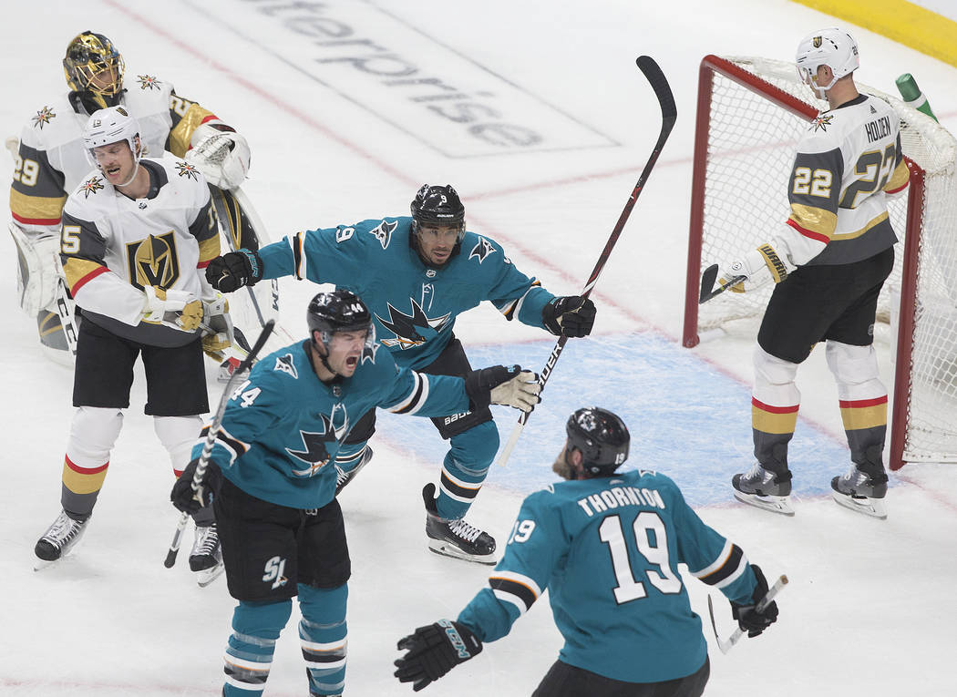 San Jose Sharks defenseman Marc-Edouard Vlasic (44) celebrates with teammates Joe Thornton (19) ...