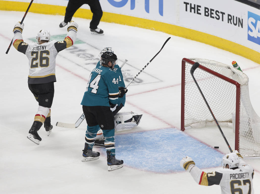 Golden Knights center Paul Stastny (26) celebrates with teammate Max Pacioretty (67) after a th ...